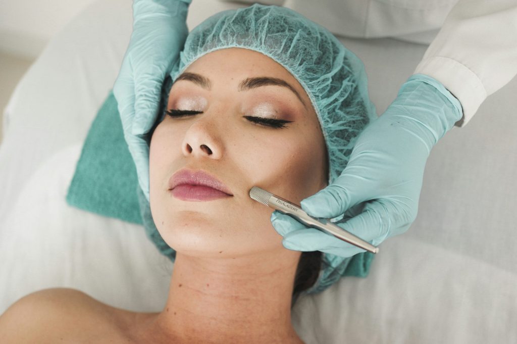 woman receiving facial skincare treatment